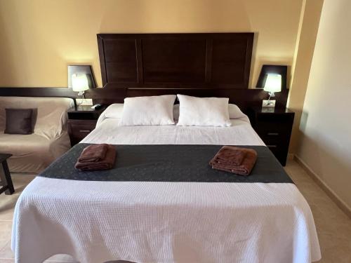 Ένα ή περισσότερα κρεβάτια σε δωμάτιο στο Hotel Don Juan
