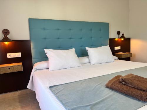 Ένα ή περισσότερα κρεβάτια σε δωμάτιο στο Hotel Don Juan