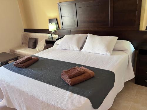 Ένα ή περισσότερα κρεβάτια σε δωμάτιο στο Hotel Don Juan