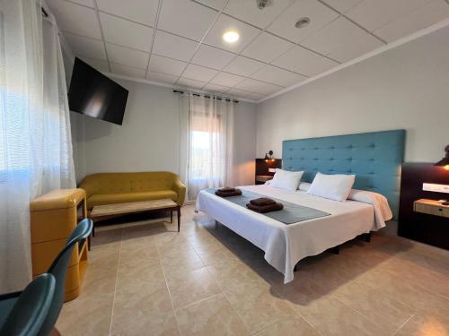 Postel nebo postele na pokoji v ubytování Hotel Don Juan