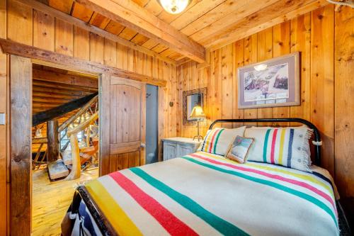 a bedroom with a bed in a wooden cabin at about 13 Mi to Main St Park City Cabin with Mtn Views! in Park City