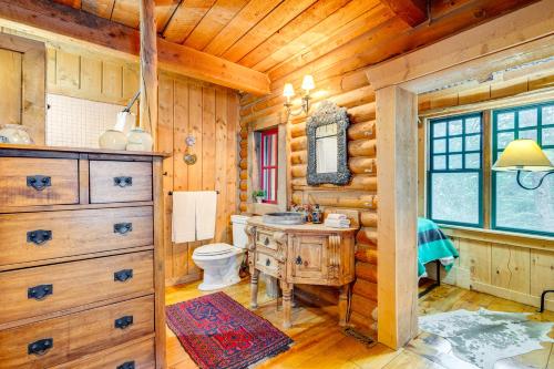 a log cabin bathroom with a sink and a toilet at about 13 Mi to Main St Park City Cabin with Mtn Views! in Park City