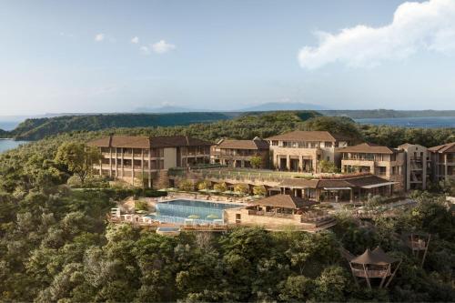 an aerial view of a resort with a swimming pool at Nekajui, a Ritz-Carlton Reserve in Papagayo, Guanacaste