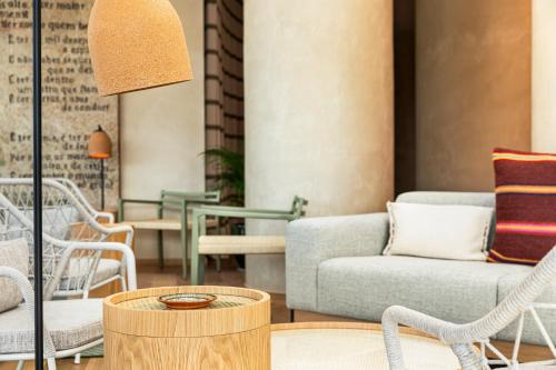 a living room with a couch and chairs at Holiday Inn Beja by IHG in Beja