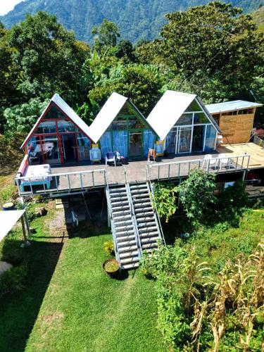 a house with a staircase leading up to it at Mundo Abu San Juan La laguna in San Juan La Laguna