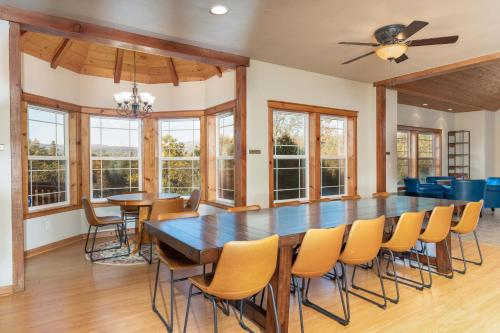 a dining room with a large table and chairs at Luxury Lodge-Hot Tub-BBQ-Sleeps 18 in Oakhurst