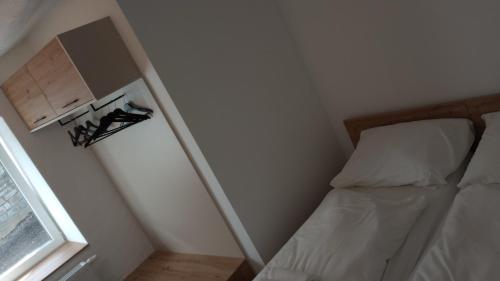 Un ou plusieurs lits dans un hébergement de l'établissement NRV twee-persoonskamer met gemeenschappelijke keuken