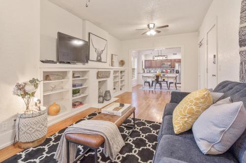 a living room with a blue couch and a table at Carson Flats Apt 5 - 1BR Near BOK, OSU Med, Dtwn in Tulsa