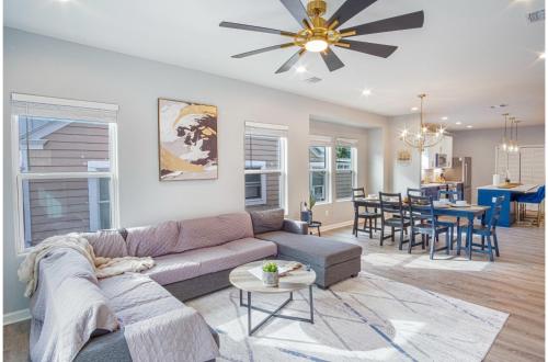 a living room with a couch and a dining room at Lovely Charming 4BR2.5BA Near Downtowns Prime in San Antonio
