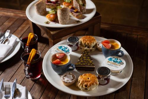 a table with two plates of food on a table at Holiday Inn Manchester - City Centre by IHG in Manchester