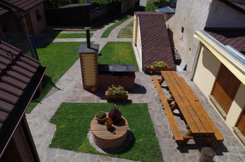 an overhead view of a garden with a bench and grass at Ubytování a apartmány Sluníčko in Lomnice nad Lužnicí