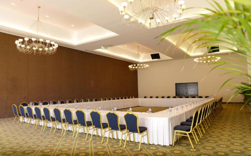a conference room with a long table and chairs at Crown Paradise Club Cancun - All Inclusive in Cancún