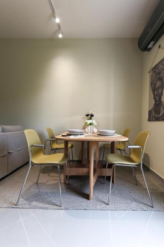 a dining room with a table and chairs at LĀr - the Hidden Gem in Anatolí