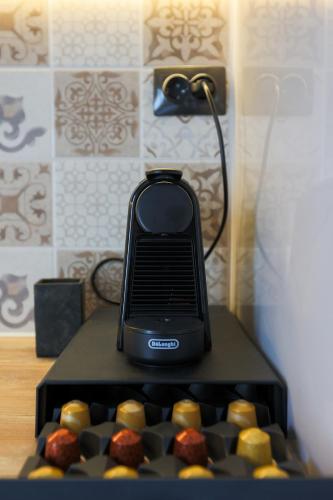 a black phone sitting on top of a table at LĀr - the Hidden Gem in Anatolí