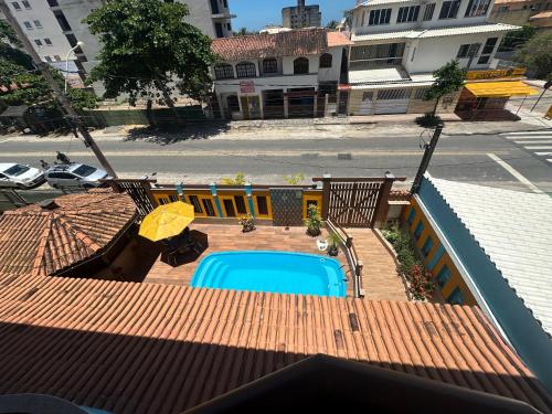 an overhead view of a swimming pool on a roof at Pousada Maravista in Anchieta