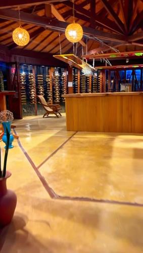 a room with a wooden floor and lights at Cabana Spa São Roque in São Roque