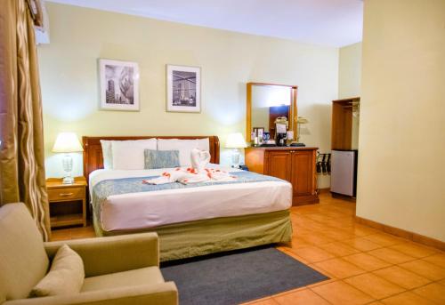 Postel nebo postele na pokoji v ubytování Rolson Hotel