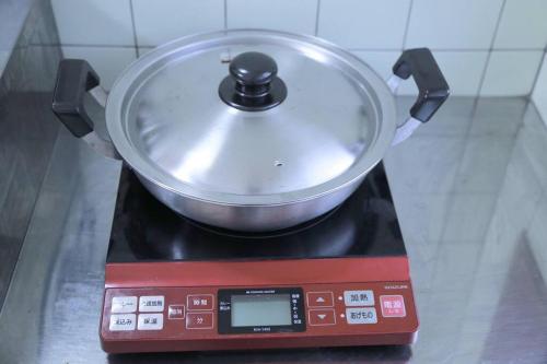 a pot sitting on top of a stove at PHEBE3osaka in Osaka