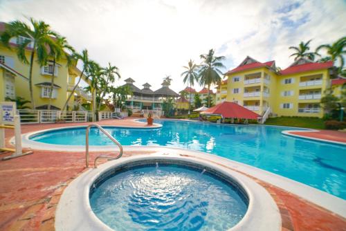 a pool at a resort with a hot tub at Mystical Studios King in Ocho Rios