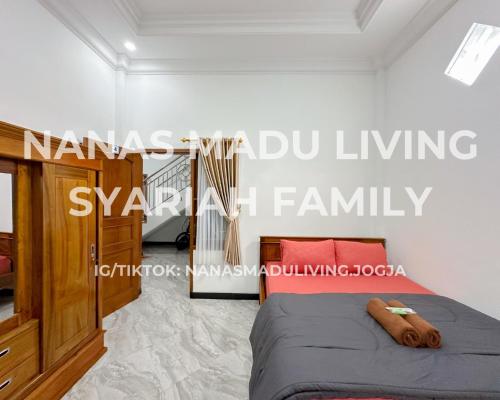 a bedroom with a bed in a room at Nanas Madu Living Syariah Family in Adi Sutjipto