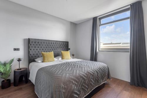 Postel nebo postele na pokoji v ubytování ALVA Apartments