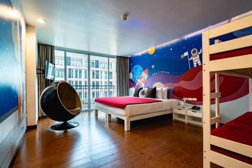 Postel nebo postele na pokoji v ubytování Hotel J Pattaya