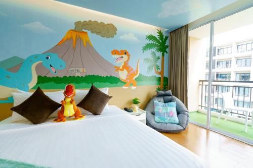 Postel nebo postele na pokoji v ubytování Hotel J Pattaya