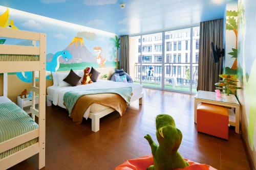 Postel nebo postele na pokoji v ubytování Hotel J Pattaya