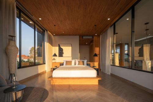 Ένα ή περισσότερα κρεβάτια σε δωμάτιο στο OASI House Canggu Managed by Nagisa Bali