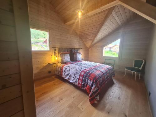 an overhead view of a bedroom in a log cabin at Chalet familial avec sauna et terrasse près du lac - FR-1-589-758 in Xonrupt-Longemer