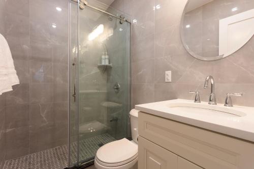 a bathroom with a shower and a toilet and a sink at Little manhattan near Time Square in New York