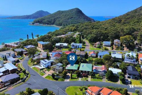 an aerial view of a suburb next to the ocean at Sea Change in Shoal Bay