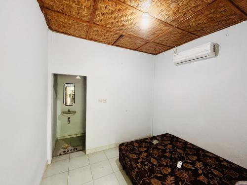 Postel nebo postele na pokoji v ubytování Eco Lamun - Rooms