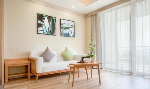 Χώρος καθιστικού στο The Q Hotel & Suite Vientiane 万象Q套房酒店