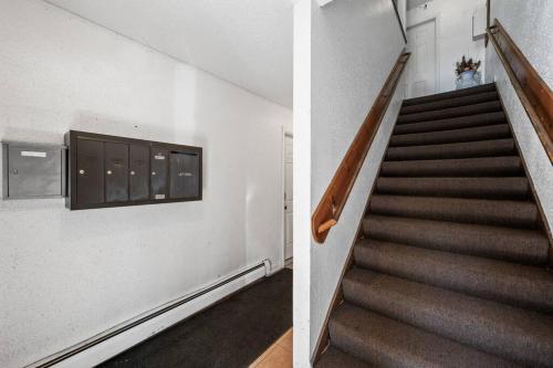 a staircase in a building with a stair case at Tranquil 2BR Apt Mpls - 8075 Apt 4 in Spring Lake Park