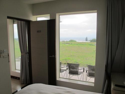 Ein Bett oder Betten in einem Zimmer der Unterkunft 日初山莊 Sunrise Taitung
