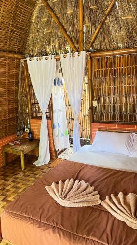 Postel nebo postele na pokoji v ubytování el bamboo guesthouse