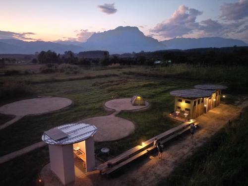 an aerial view of a house in a field at Daraga ดารกะ in Chiang Dao