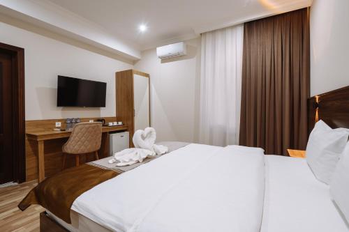 Katil atau katil-katil dalam bilik di Sofiya Tashkent Hotel