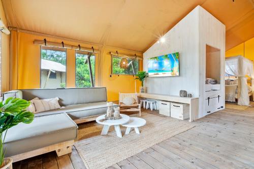 a living room with a couch and a table at Ingenia Holidays Noosa in Tewantin