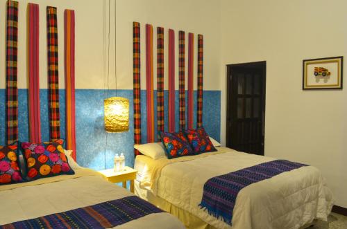 Katil atau katil-katil dalam bilik di Luna Maya Boutique Hotel