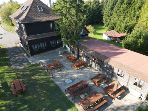 an overhead view of a building with chairs and tables at Chata Maxe Švabinského in Česká Třebová