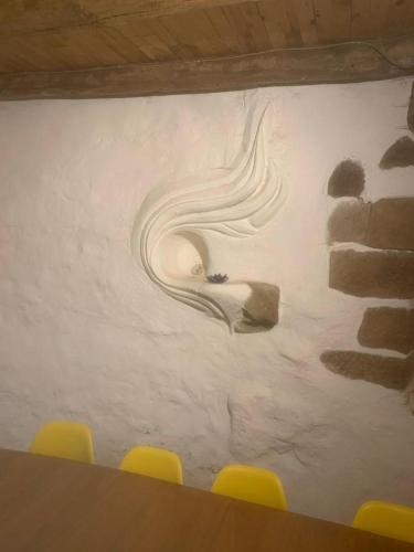 a wall with a painting of a snake on it at Gîte de la Bastide - Cabania Pays Cathare in Camps-sur-lʼAgly