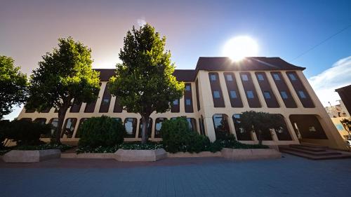 a large building with trees in front of it at Bamberg Burgblick in Bamberg