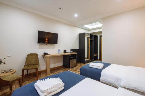 Katil atau katil-katil dalam bilik di Sofiya Tashkent Hotel
