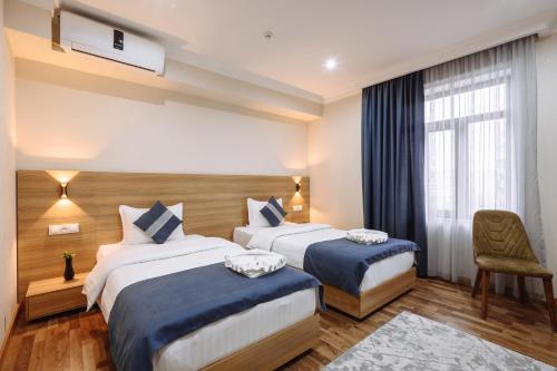 Katil atau katil-katil dalam bilik di Sofiya Tashkent Hotel