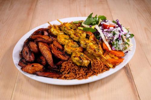 a plate of food with noodles and a salad at CDQI Hotel in Ottawa