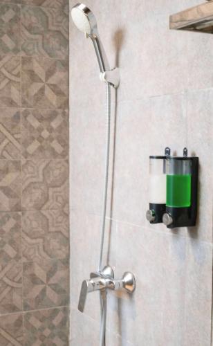 a shower head on a wall in a bathroom at ME Villa Pererenan in Canggu