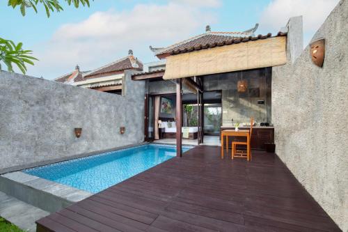 an external view of a house with a swimming pool at ME Villa Pererenan in Canggu