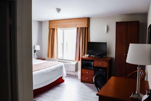 Postel nebo postele na pokoji v ubytování Super 8 by Wyndham Campbellton NB